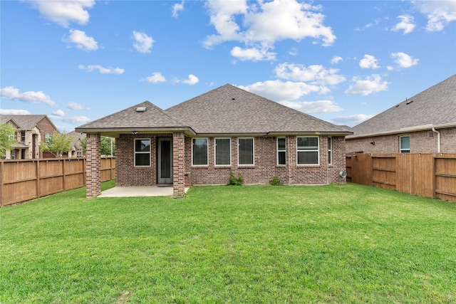 19815 Caprock Falls Ct, Cypress, TX 77433 - back of property with brick siding, a patio area, roof with shingles, and a fenced backyard