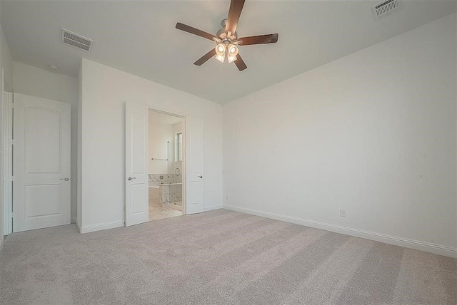 2040 Terra Rose Dr, Katy, TX 77493 - unfurnished bedroom with light colored carpet, ensuite bath, and a ceiling fan