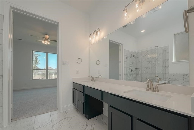 2040 Terra Rose Dr, Katy, TX 77493 - full bath with a marble finish shower, double vanity, marble look tile flooring, and a ceiling fan