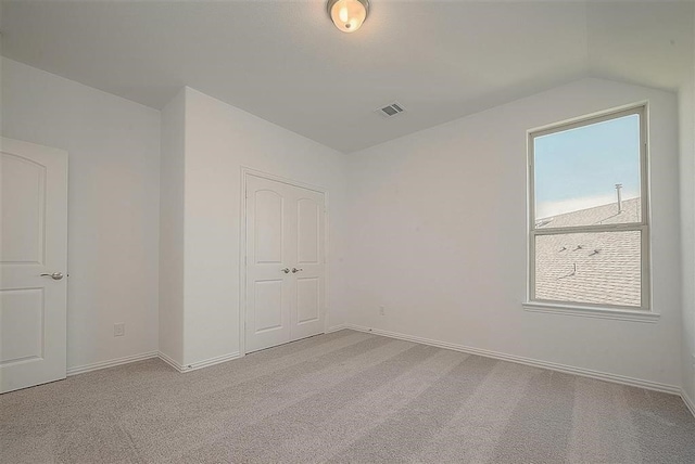 2040 Terra Rose Dr, Katy, TX 77493 - unfurnished bedroom with light colored carpet, vaulted ceiling, and a closet