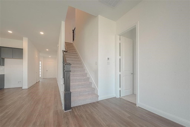 2040 Terra Rose Dr, Katy, TX 77493 - stairs featuring wood finished floors and recessed lighting