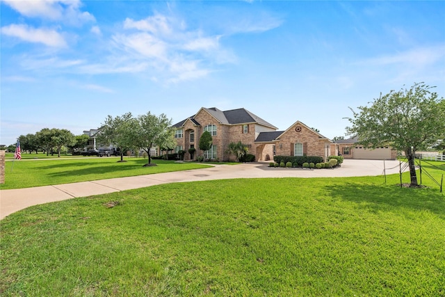 3211 Lakes Of Katy Ln, Katy, TX 77493 - traditional home with a front lawn, curved driveway, and brick siding