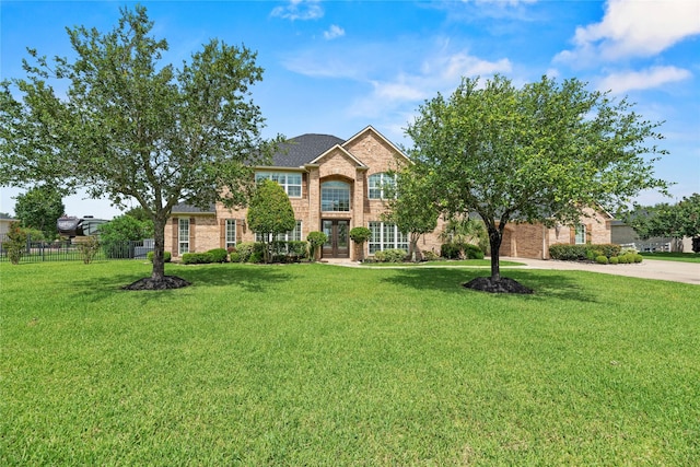 3211 Lakes Of Katy Ln, Katy, TX 77493 - view of front of house featuring brick siding, french doors, and driveway