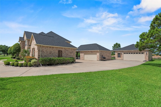 3211 Lakes Of Katy Ln, Katy, TX 77493 - view of front of home featuring brick siding, a front yard, a shingled roof, and driveway