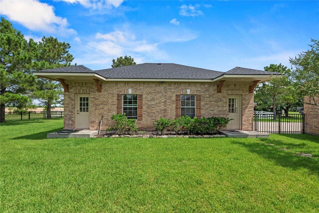 3211 Lakes Of Katy Ln, Katy, TX 77493 - rear view of property with brick siding and roof with shingles