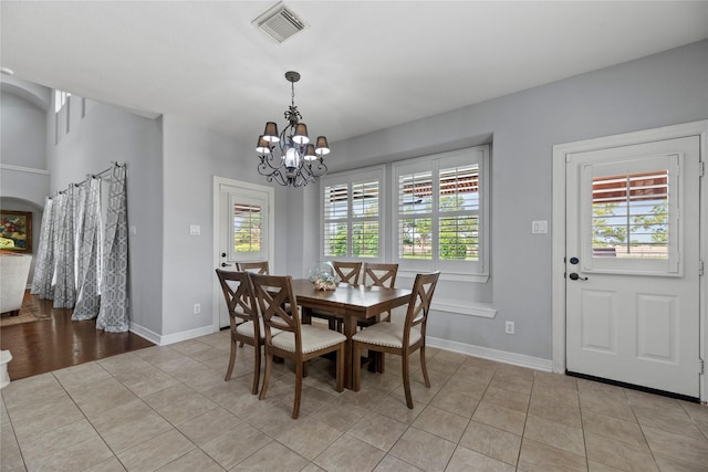 3211 Lakes Of Katy Ln, Katy, TX 77493 - dining room with healthy amount of natural light, a chandelier, and light tile patterned flooring