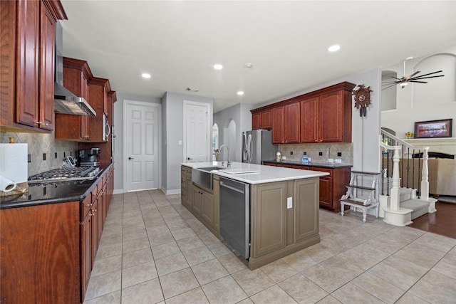 3211 Lakes Of Katy Ln, Katy, TX 77493 - kitchen featuring appliances with stainless steel finishes, wall chimney exhaust hood, light tile patterned floors, decorative backsplash, and recessed lighting