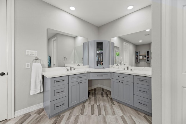 3211 Lakes Of Katy Ln, Katy, TX 77493 - full bathroom with double vanity, wood finished floors, and recessed lighting