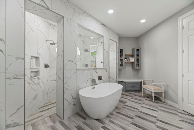 3211 Lakes Of Katy Ln, Katy, TX 77493 - bathroom featuring a marble finish shower, a freestanding tub, recessed lighting, and wood finished floors