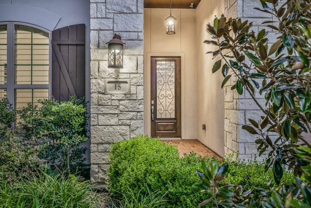 15 Floral Hills Ln, Fulshear, TX 77441 - property entrance with stone siding