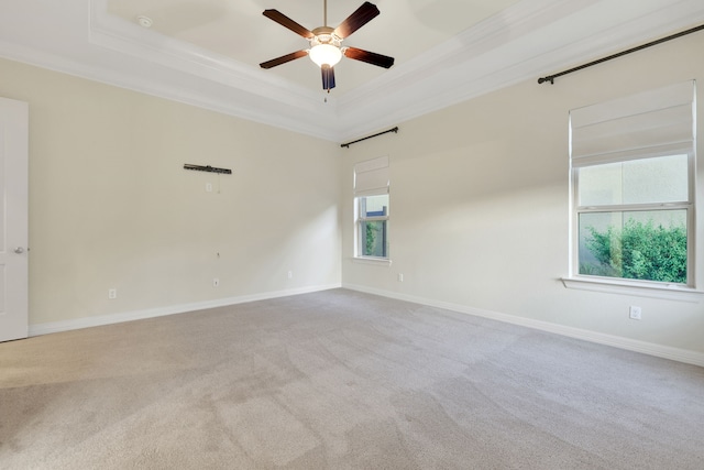 15 Floral Hills Ln, Fulshear, TX 77441 - empty room featuring a raised ceiling, crown molding, carpet flooring, and ceiling fan