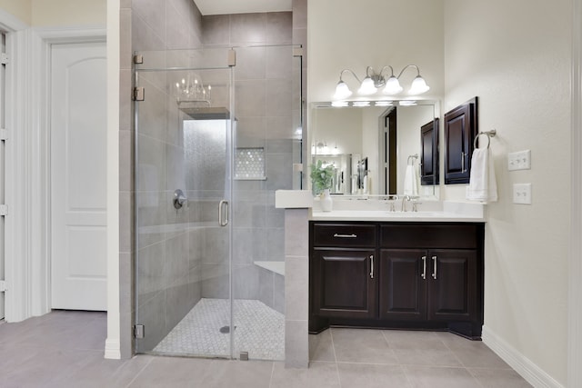 15 Floral Hills Ln, Fulshear, TX 77441 - bathroom featuring vanity, tile patterned floors, and a stall shower