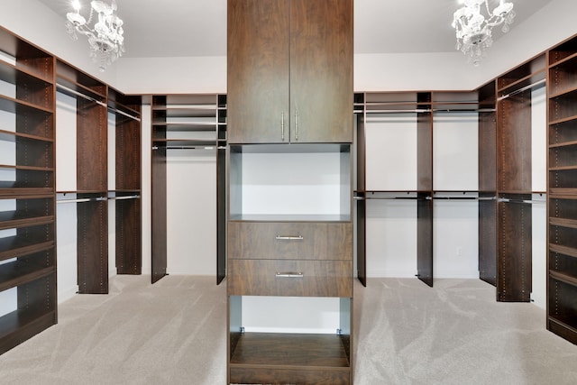 15 Floral Hills Ln, Fulshear, TX 77441 - walk in closet featuring a chandelier and carpet flooring