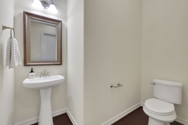 15 Floral Hills Ln, Fulshear, TX 77441 - bathroom with toilet and wood finished floors