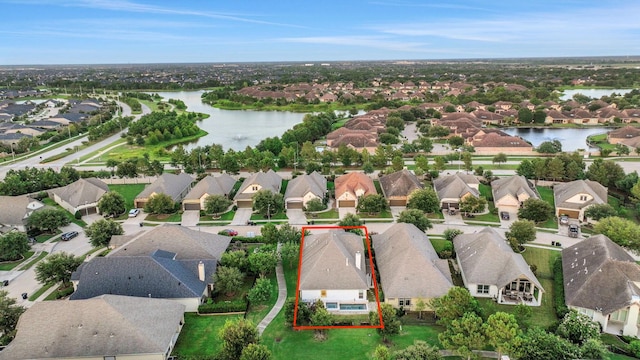 15 Floral Hills Ln, Fulshear, TX 77441 - aerial perspective of suburban area featuring a nearby body of water and property boundaries highlighted
