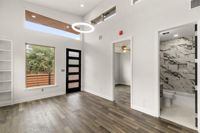 4817 Los Angeles St, Houston, TX 77026 - foyer entrance featuring recessed lighting, a towering ceiling, dark wood finished floors, and ceiling fan