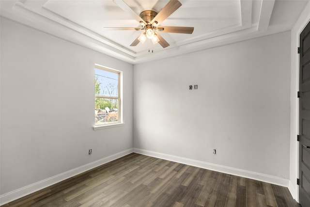4817 Los Angeles St, Houston, TX 77026 - unfurnished room featuring a tray ceiling, dark wood finished floors, and ceiling fan