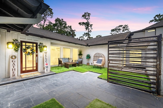 12422 Cobblestone Dr, Houston, TX 77024 - patio terrace at dusk featuring an outdoor hangout area and a patio