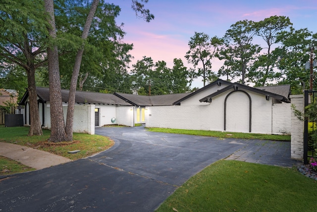 12422 Cobblestone Dr, Houston, TX 77024 - view of front facade featuring driveway and a front yard