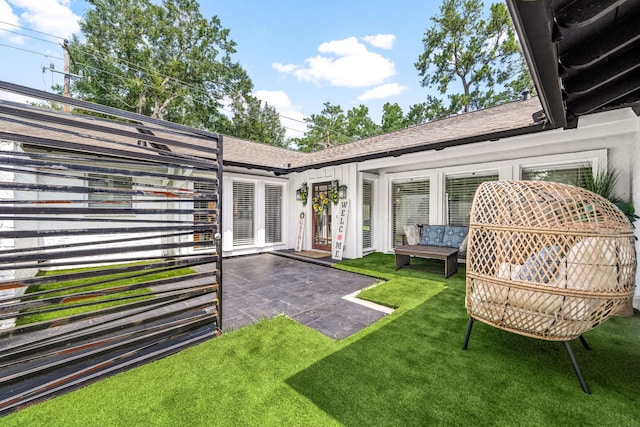 12422 Cobblestone Dr, Houston, TX 77024 - view of grassy yard with french doors and a patio area