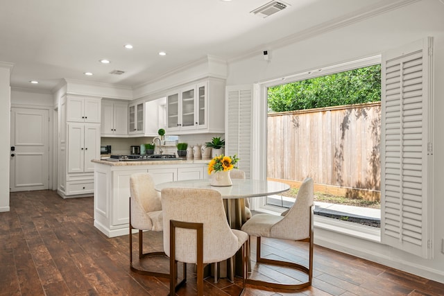 12422 Cobblestone Dr, Houston, TX 77024 - dining area with crown molding, dark wood-type flooring, and recessed lighting