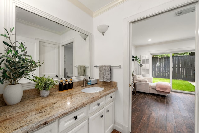12422 Cobblestone Dr, Houston, TX 77024 - bathroom featuring crown molding, vanity, and wood finished floors