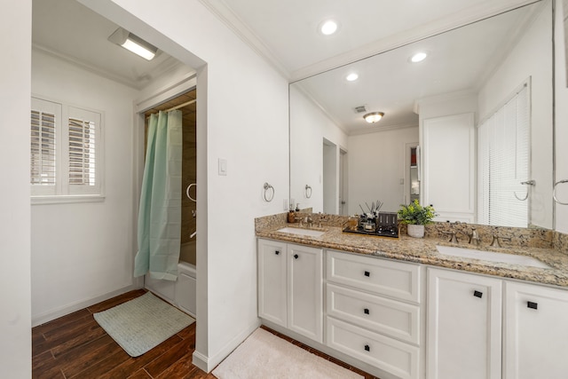 12422 Cobblestone Dr, Houston, TX 77024 - full bath featuring crown molding, wood finished floors, double vanity, shower / tub combo with curtain, and recessed lighting