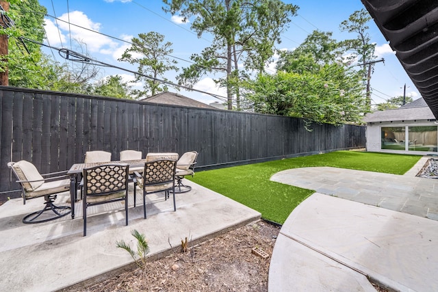 12422 Cobblestone Dr, Houston, TX 77024 - fenced backyard featuring a patio area and outdoor dining space