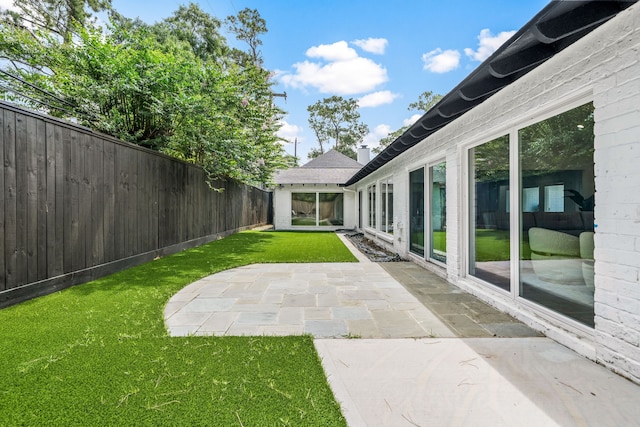 12422 Cobblestone Dr, Houston, TX 77024 - fenced backyard featuring a patio
