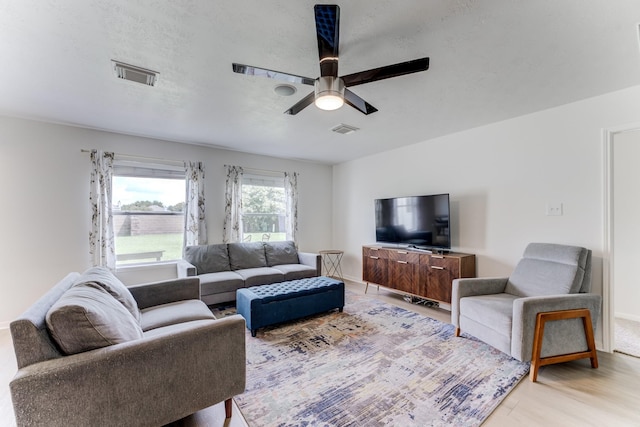 17814 Placid Oak Ct, Cypress, TX 77433 - living room featuring a ceiling fan and light wood-type flooring