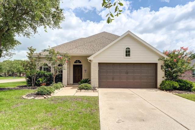 17814 Placid Oak Ct, Cypress, TX 77433 - single story home with concrete driveway, brick siding, a front yard, and a garage