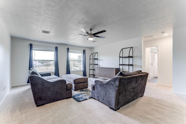17814 Placid Oak Ct, Cypress, TX 77433 - carpeted living room with a ceiling fan and a textured ceiling