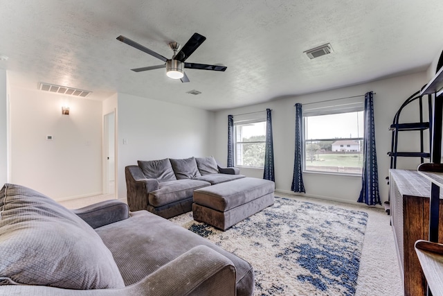 17814 Placid Oak Ct, Cypress, TX 77433 - living area featuring a ceiling fan, carpet floors, and a textured ceiling