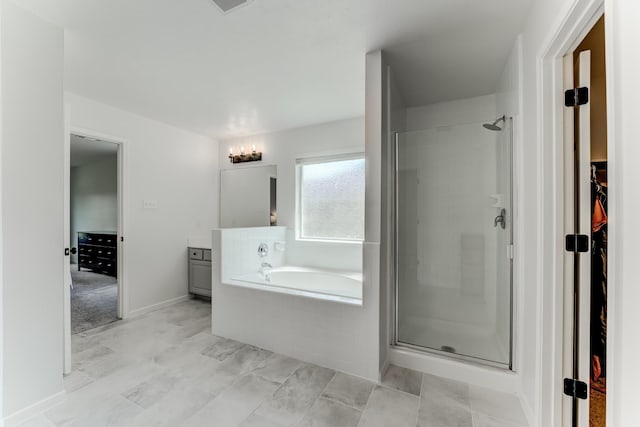 17814 Placid Oak Ct, Cypress, TX 77433 - bathroom featuring a stall shower, a garden tub, a walk in closet, and vanity