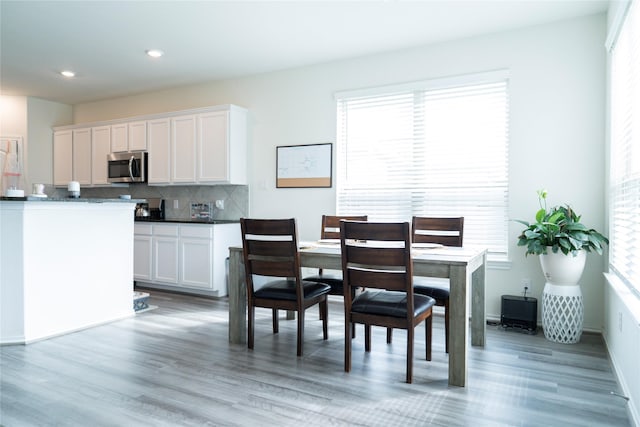 18802 Verdura Dr, New Caney, TX 77357 - dining space with light wood-style flooring, healthy amount of natural light, and recessed lighting