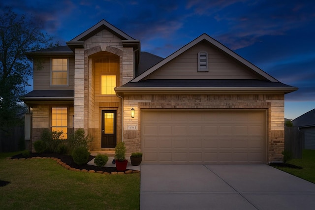 18802 Verdura Dr, New Caney, TX 77357 - view of front of property featuring concrete driveway, a garage, a lawn, and stone siding