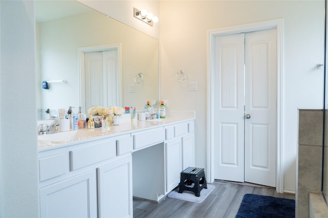 18802 Verdura Dr, New Caney, TX 77357 - full bathroom with double vanity and wood finished floors