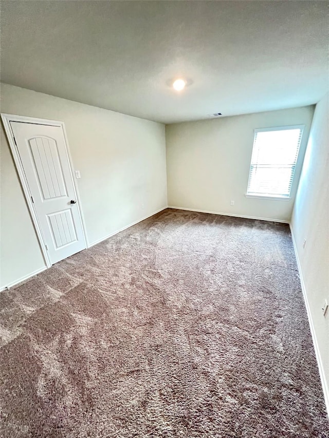 18802 Verdura Dr, New Caney, TX 77357 - empty room featuring carpet floors and baseboards