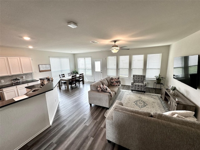 18802 Verdura Dr, New Caney, TX 77357 - living area featuring dark wood-type flooring, a ceiling fan, and recessed lighting
