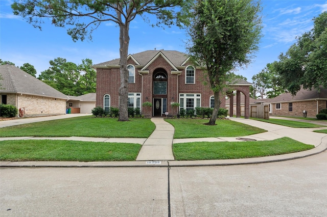 10906 Silverado Trace Dr, Houston, TX 77095 - view of front of property featuring a front yard and brick siding
