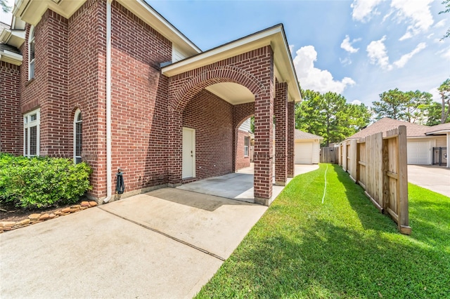 10906 Silverado Trace Dr, Houston, TX 77095 - view of side of home with brick siding and a yard