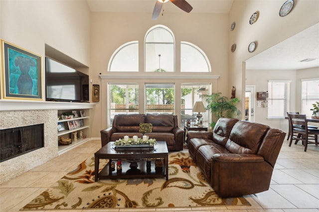 10906 Silverado Trace Dr, Houston, TX 77095 - living area with ceiling fan, tile patterned flooring, plenty of natural light, and a towering ceiling