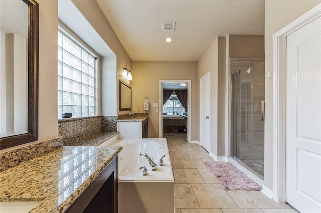 10906 Silverado Trace Dr, Houston, TX 77095 - bathroom featuring a shower stall, vanity, a garden tub, a ceiling fan, and tile patterned flooring