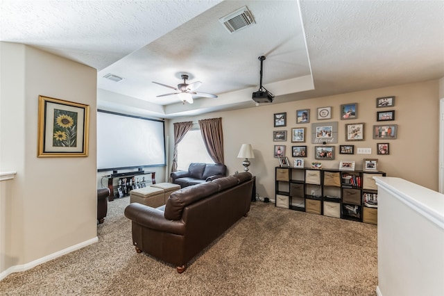 10906 Silverado Trace Dr, Houston, TX 77095 - carpeted cinema featuring a raised ceiling, a textured ceiling, and a ceiling fan