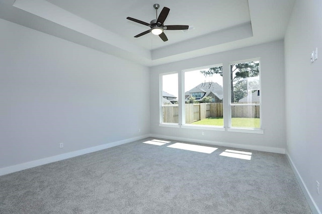 29838 Beth Ter, Fulshear, TX 77441 - empty room featuring a raised ceiling, carpet, and ceiling fan