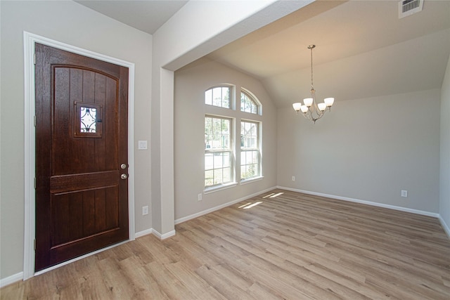 2926 Grand Hawthorne Rd, Conroe, TX 77385 - foyer featuring light wood-type flooring, a chandelier, and lofted ceiling
