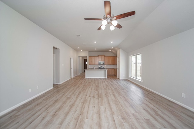 2926 Grand Hawthorne Rd, Conroe, TX 77385 - unfurnished living room with ceiling fan, light wood-style floors, lofted ceiling, and recessed lighting