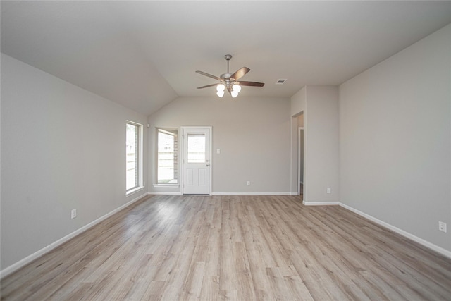 2926 Grand Hawthorne Rd, Conroe, TX 77385 - unfurnished room with a ceiling fan, light wood-style floors, and vaulted ceiling