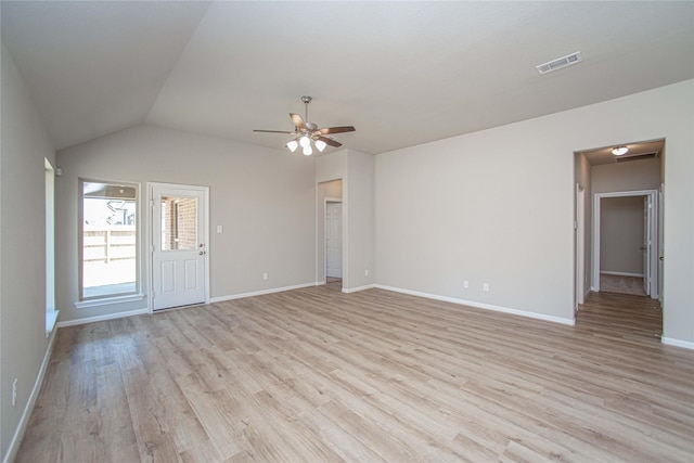 2926 Grand Hawthorne Rd, Conroe, TX 77385 - unfurnished living room featuring light wood finished floors, ceiling fan, and lofted ceiling