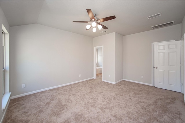 2926 Grand Hawthorne Rd, Conroe, TX 77385 - unfurnished bedroom featuring carpet, lofted ceiling, ensuite bathroom, and ceiling fan